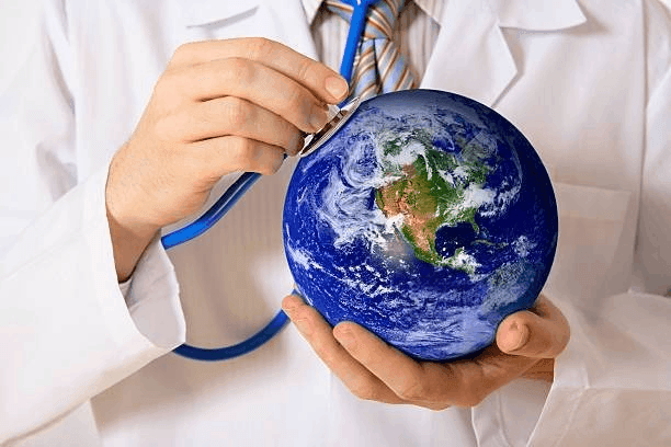 Doctor holding a globe